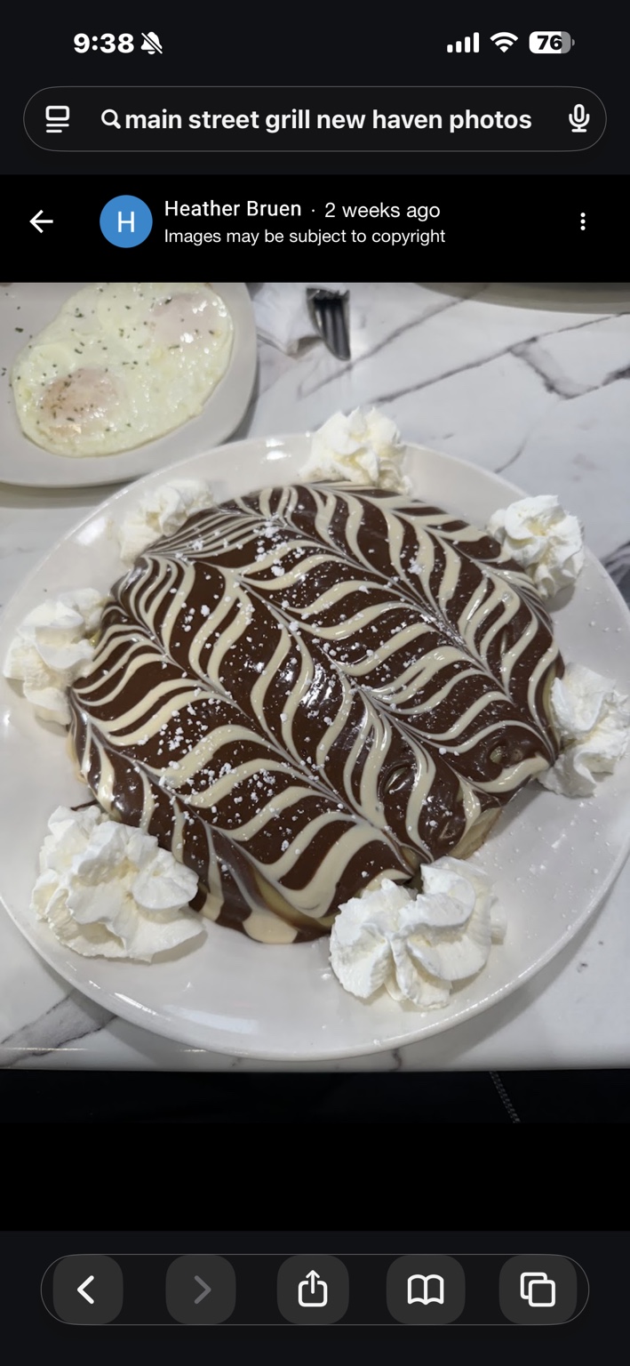 Chocolate-drizzled crepes with whipped cream
